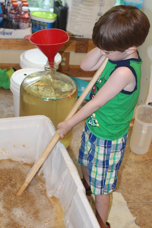 Silas stirring the mash